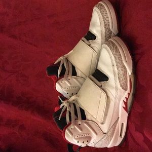 White and cement gray with red Jordan’s.